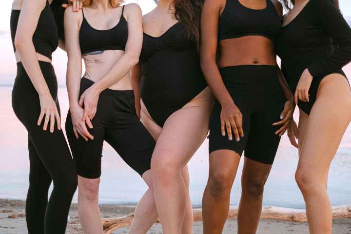 five different bodies, in all shapes and colours representing body positivity